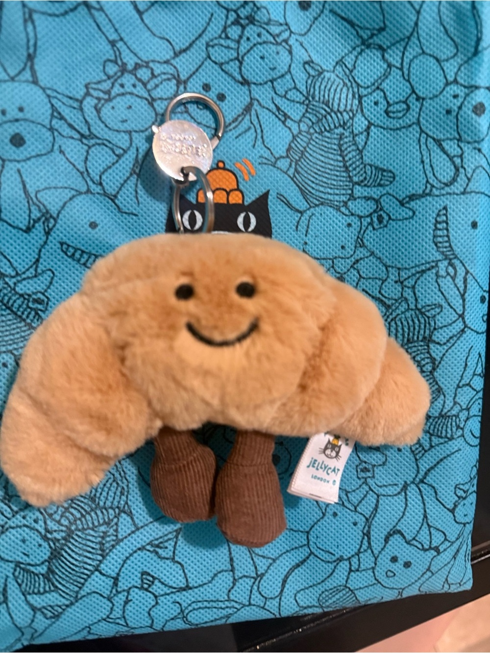 Jellycat Drawstring Tote Bag in Aqua with Black Logo